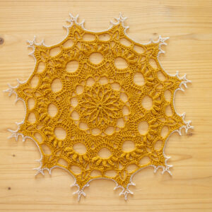 Golden crochet doily, 28 cm