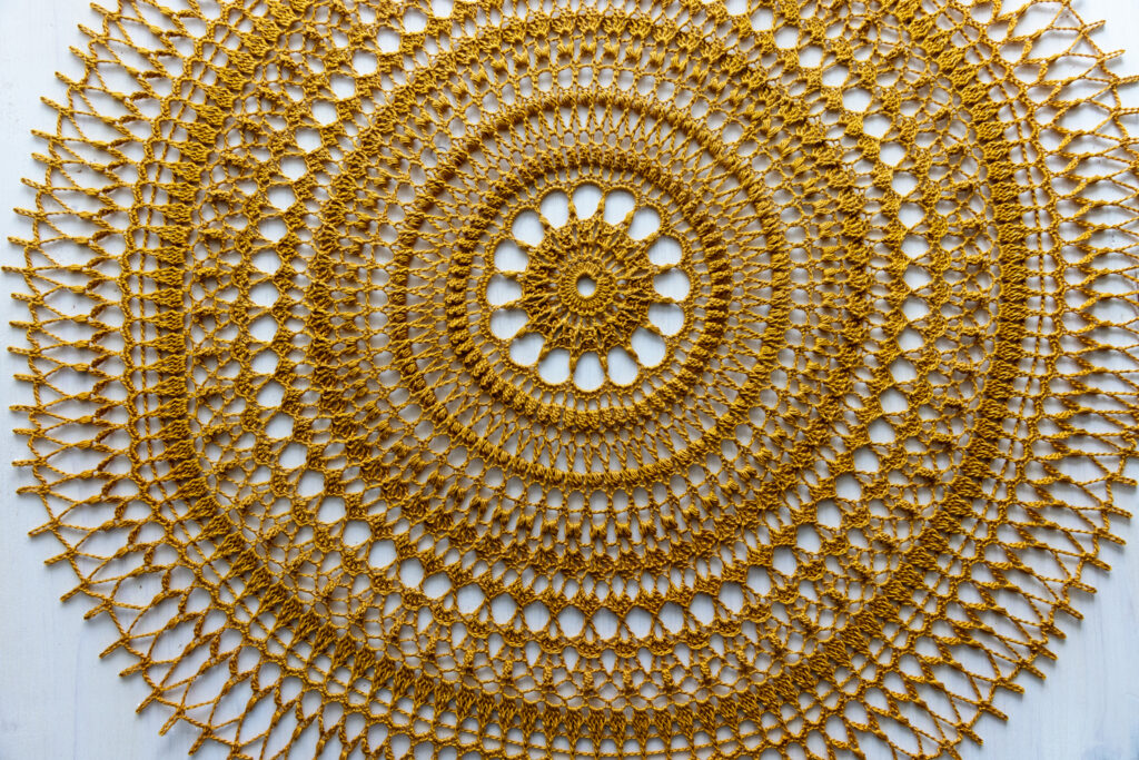 Golden crochet doily Ignatia, 56 cm