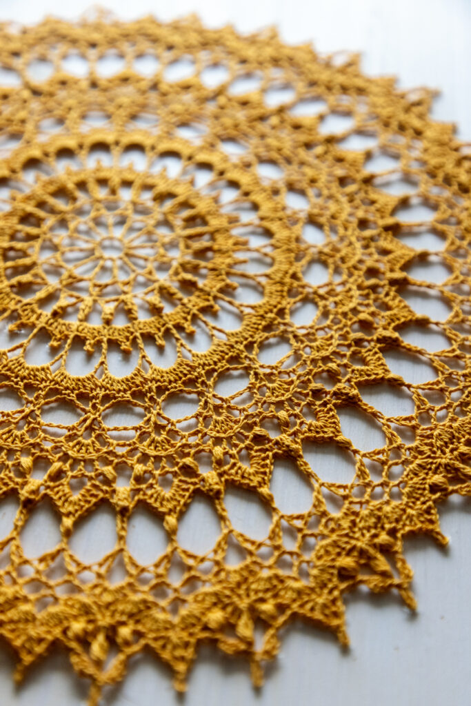 Beautiful gold crochet doily Radmila, 35 cm