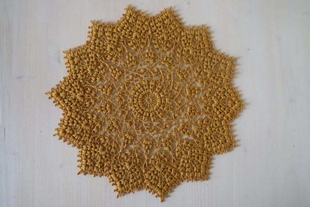 Gold crochet doily Lidia, 31 cm