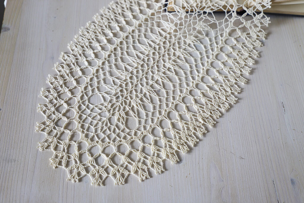 Beige oval crochet doily, 44×26 cm