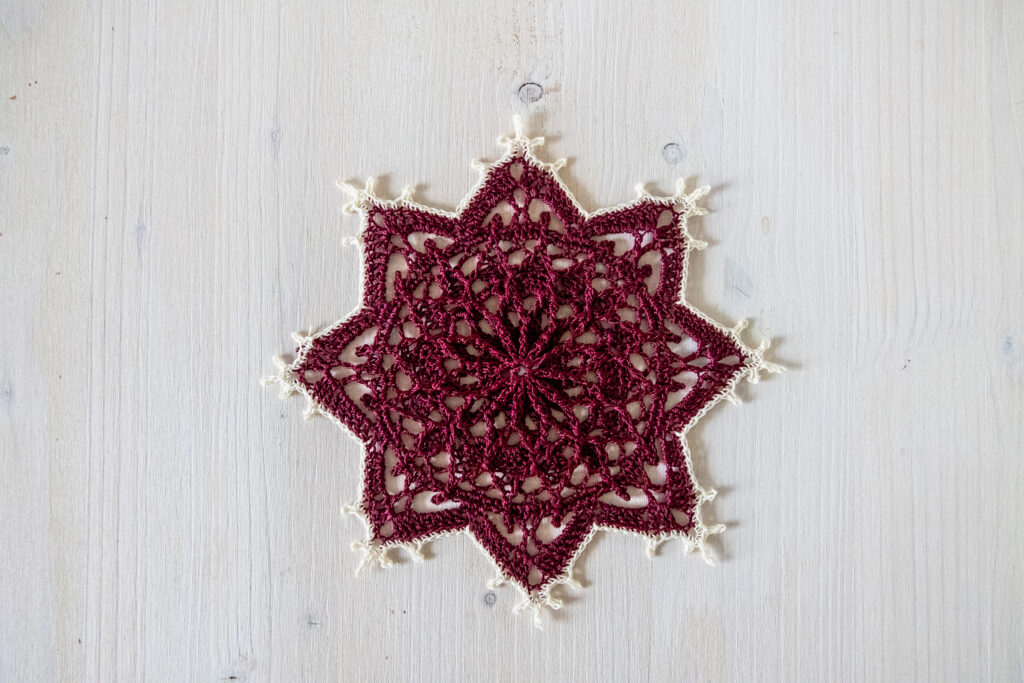 Bordó red crochet doily, 5 in