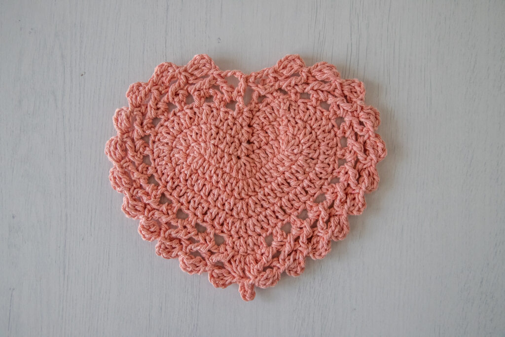 Pink crochet coaster, heart doily