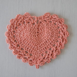 Pink crochet coaster, heart doily