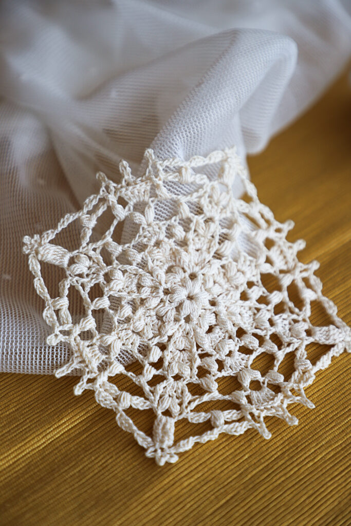 Ivory crochet doily Alida, by Olga Shalaeva, 14 cm